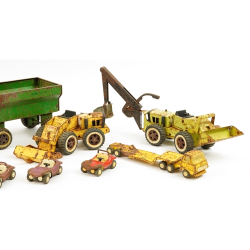 1568 - Vintage Tonka Toys tinplate vehicles including tractor with trailer and dumper truck, the largest 57... 