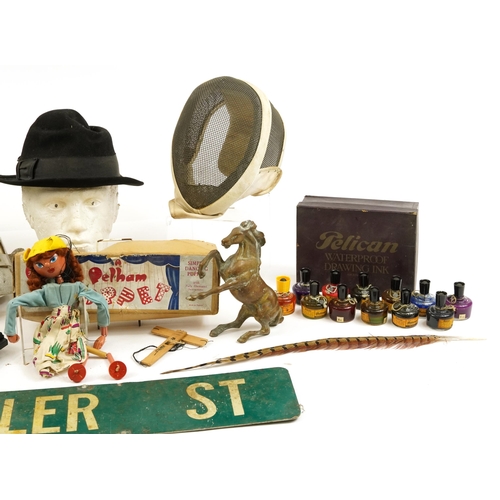 1180 - Sundry items including a vintage Tyler St metal sign, two fencing helmets, Pelham puppet with box an... 