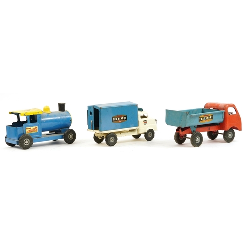 1573 - Two vintage Tri-ang tinplate trucks and an Express locomotive, the largest 34cm in length