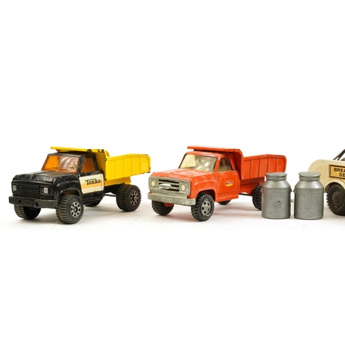 1569A - Four vintage tinplate Marx and Tri-ang vehicles including break down service truck and express deliv... 