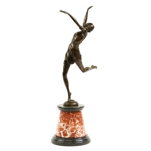 378 - Large patinated bronze figurine of an Art Deco female dancing raised on a tapered marble and black s... 