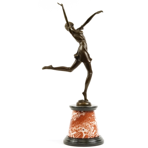 378 - Large patinated bronze figurine of an Art Deco female dancing raised on a tapered marble and black s... 