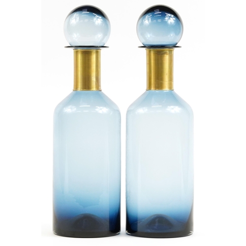 302 - Pair of oversized blue glass display scent bottles with stoppers in the style of Holmegaard, each 53... 