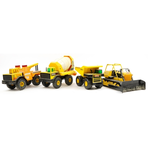 1567 - Four large Tonka construction vehicles including T9 Mighty Tonka Dozer, the largest 54cm in length