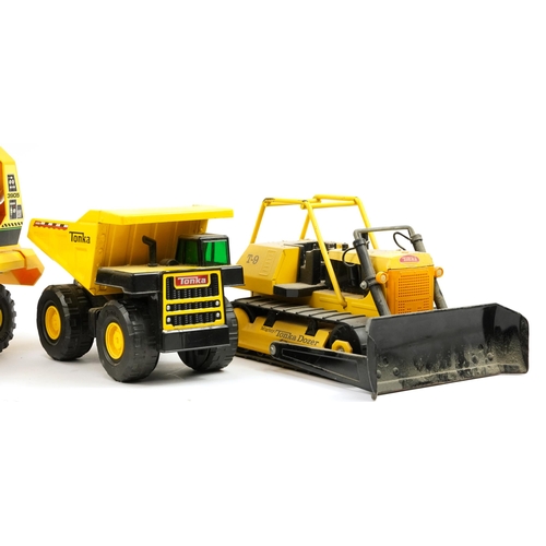 1567 - Four large Tonka construction vehicles including T9 Mighty Tonka Dozer, the largest 54cm in length