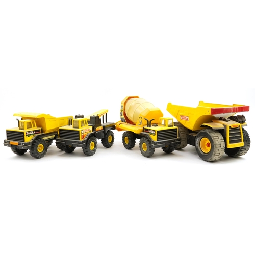 1566 - Four Tonka construction vehicles including cement mixer and dumper truck, the largest 54cm in length