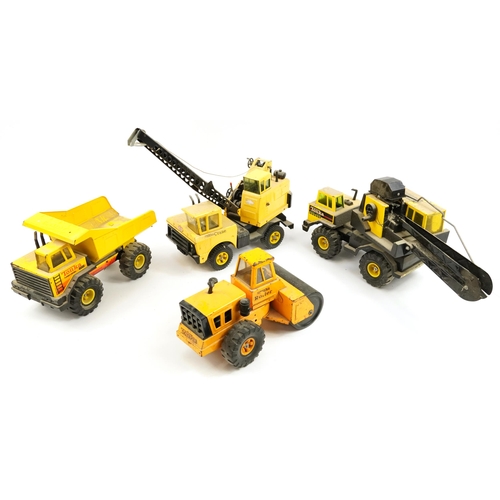 1565 - Four Tonka construction vehicles including crane and steam roller, the largest 66cm in length