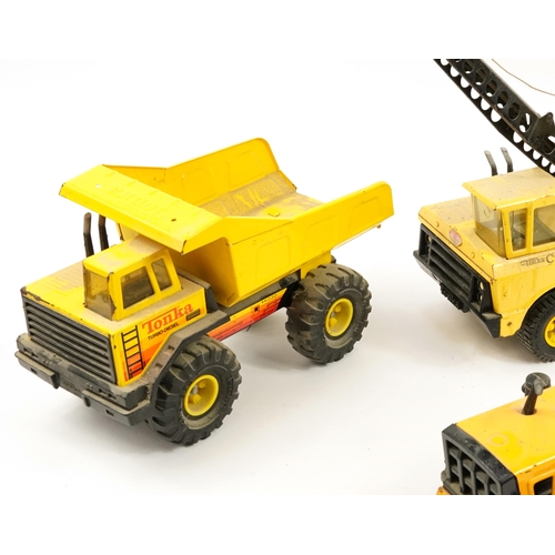 1565 - Four Tonka construction vehicles including crane and steam roller, the largest 66cm in length