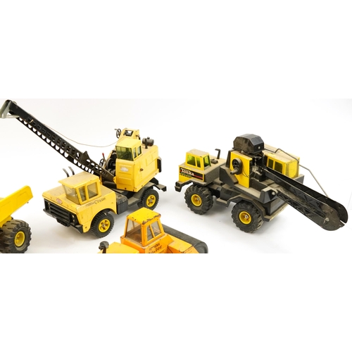 1565 - Four Tonka construction vehicles including crane and steam roller, the largest 66cm in length