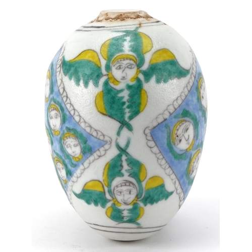 273 - Turkish Armenian pottery hanging ball hand painted with mythical faces, 10cm high