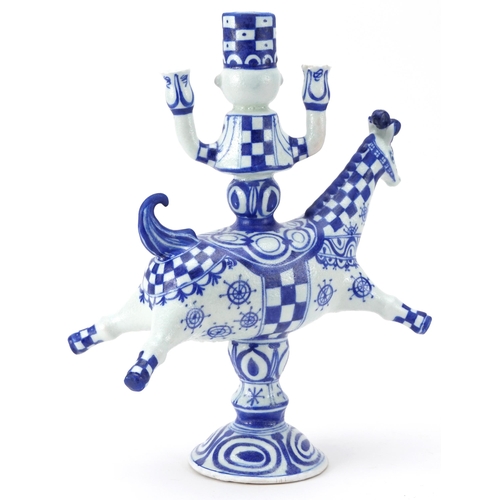 369 - Attributed to Bjorn Wiinblad, Mid century design Scandinavian pottery candlestick in the form of a f... 