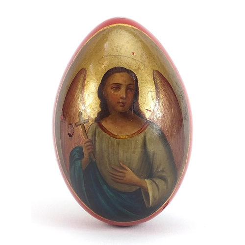 162 - Lukutin, Imperial Russian lacquered Easter egg hand painted with Archangel Mikhail, 7cm high