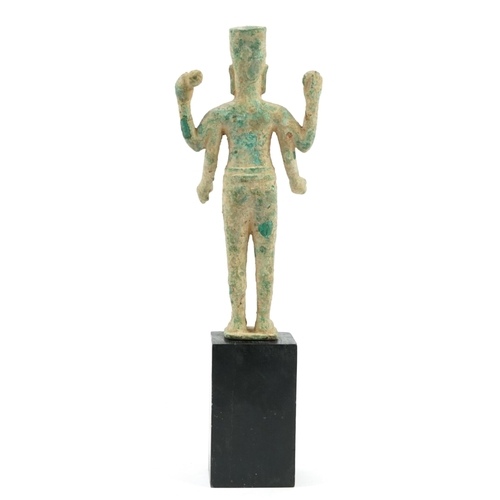 580 - South East Asian verdigris bronze figure raised on a later ebonised block base, overall 45cm high