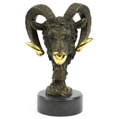 603 - Partially gilt patinated bronze bust of a ram's head raised on a circular slate base, the bronze sig... 