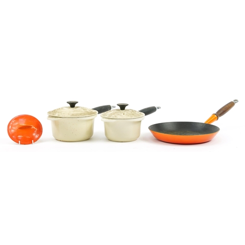 1038 - Vintage and later enamel kitchen saucepans and frying pans including Le Creuset, the largest 52.5cm ... 