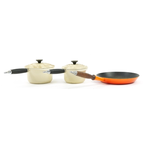 1038 - Vintage and later enamel kitchen saucepans and frying pans including Le Creuset, the largest 52.5cm ... 