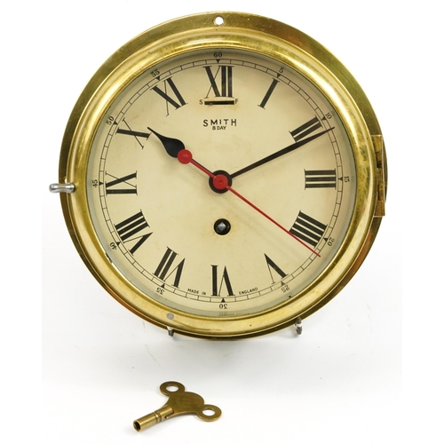 325 - Smiths ship's bulkhead design brass eight day wall clock with Roman and Arabic numerals, 22.5cm in d... 