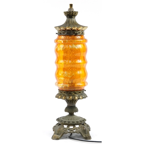 696 - Ornate brass and orange coloured glass lamp, 60.5cm high