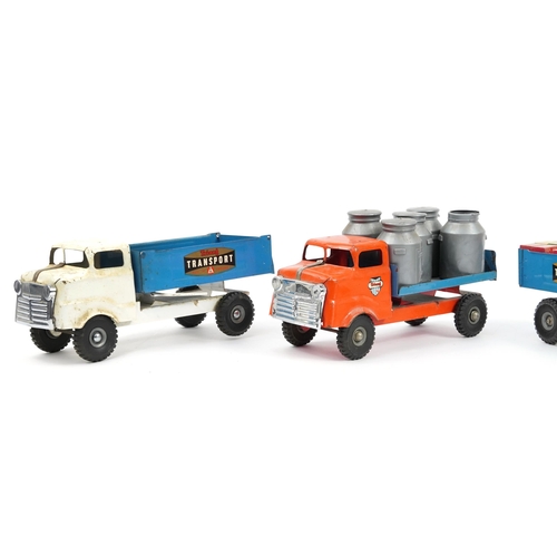 1558 - Four large vintage tinplate Tri-ang transport trucks, the largest 37cm in length