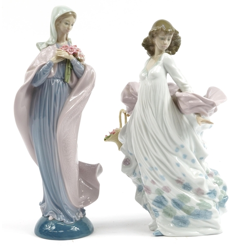 974 - Two Lladro porcelain figurines of females holding flowers, numbered 571 and 5898, the largest 32.5cm... 