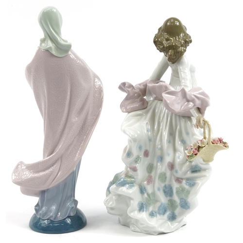 974 - Two Lladro porcelain figurines of females holding flowers, numbered 571 and 5898, the largest 32.5cm... 