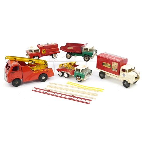 1569 - Five large vintage Tri-ang tinplate vehicles including transport truck and fire engine, the largest ... 