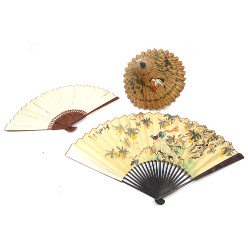 1182 - Two very large decorative Chinese wall hanging fans and a parasol, one with box, the largest 168cm w... 