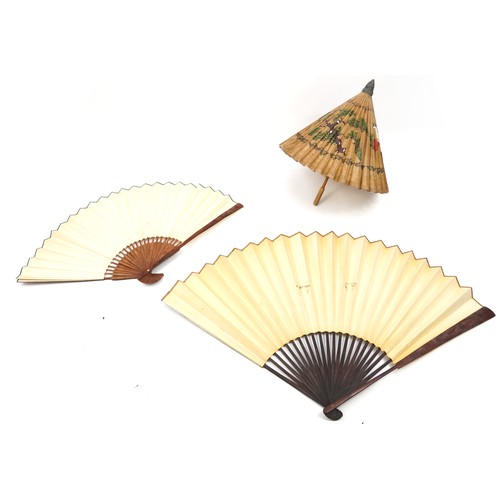 1182 - Two very large decorative Chinese wall hanging fans and a parasol, one with box, the largest 168cm w... 