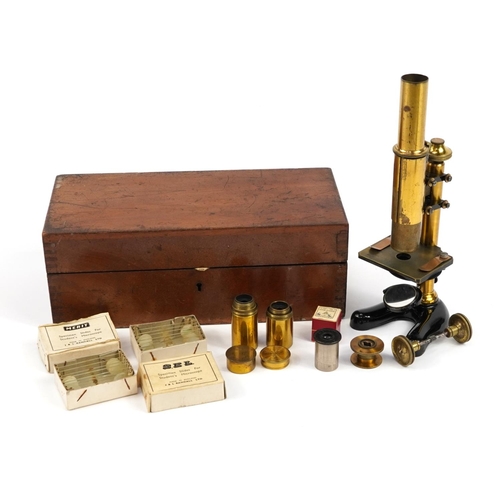 221 - E Leitz, 19th century adjustable travelling microscope with lenses and accessories housed in a fitte... 