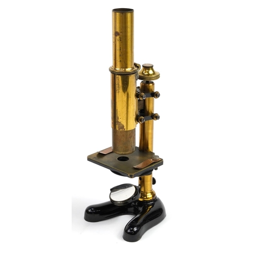 221 - E Leitz, 19th century adjustable travelling microscope with lenses and accessories housed in a fitte... 