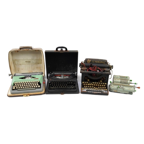 1183 - Three vintage typewriters and a Schubert Rastatt Exactus calculator comprising L C Smith & Bros, Oli... 