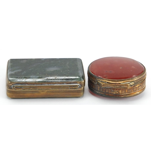 716A - Two brass pill boxes including one with moss agate, the largest 6cm wide