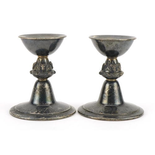 296 - Reid & Sons Ltd, pair of Arts & Crafts style silver candlesticks, Birmingham 1972, 9cm high, 237.0g