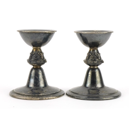 296 - Reid & Sons Ltd, pair of Arts & Crafts style silver candlesticks, Birmingham 1972, 9cm high, 237.0g