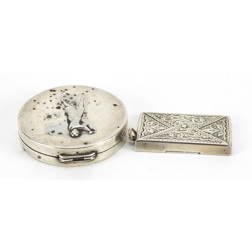 116 - Circular silver golfing interest compact and a double stamp case in the form of an envelope, the lar... 