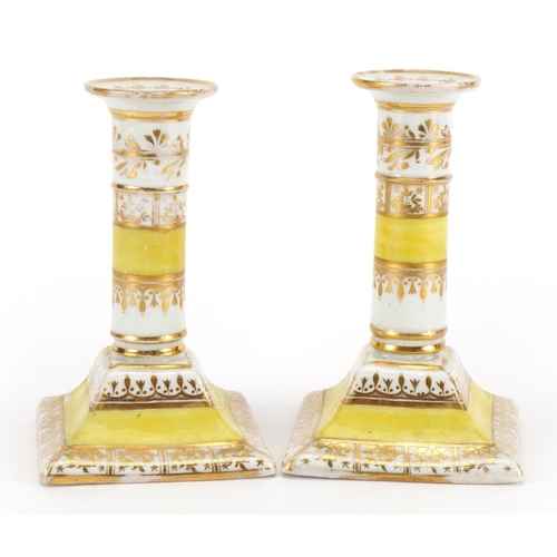 92 - Pair of early 19th century Chamberlain's Worcester porcelain candlesticks with gilt decoration, each... 