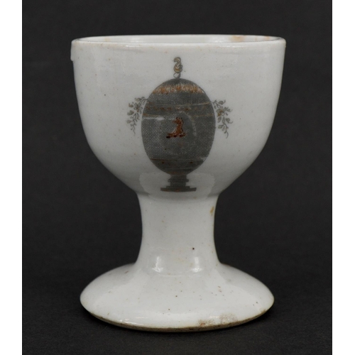 200 - Chinese porcelain eggcup hand painted and gilded with an armorial crest, Guest & Grey label to the b... 