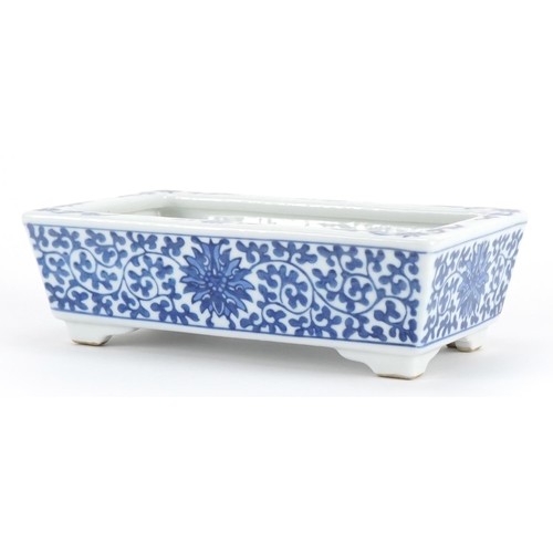 252 - Chinese blue and white porcelain four footed planter hand painted with flower heads amongst scrollin... 