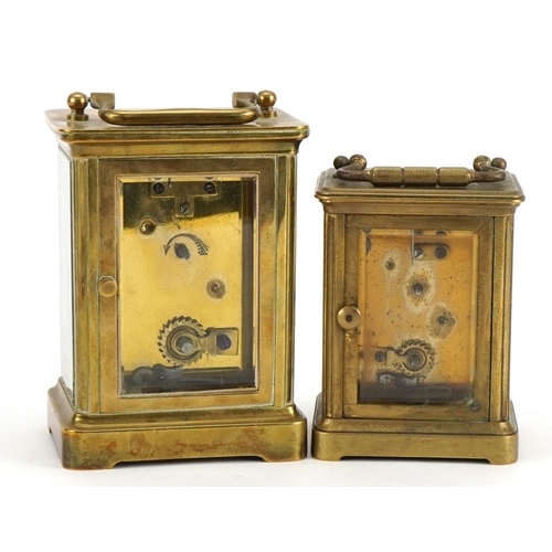 612 - Two brass cased carriage clocks with enamelled dials and Roman numerals, the largest 11cm high