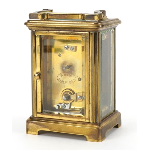 611 - Richard & Co, brass cased carriage clock with enamelled dial having Roman numerals, 11cm high