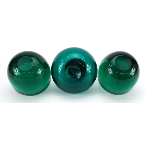 1042 - Green glass scent bottle with stopper and a pair of green glass bowls, the largest 17.5cm high