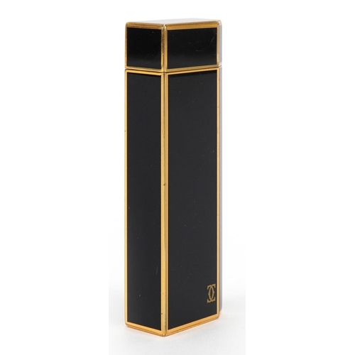 63 - Cartier gold plated and black enamel pocket lighter numbered H23649, 7cm high