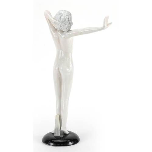 561 - Goldschneider style porcelain figurine of a nude Art Deco female, Wien mark to the base, 36cm high