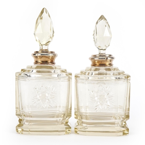 1048 - Pair of etched cut glass scent bottles with silver collars, each 15cm high