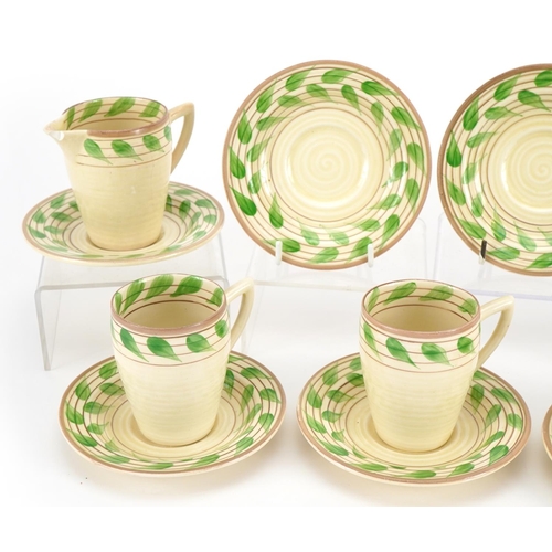 124 - Clarice Cliff, Art Deco Bizarre teaware comprising three cups, six saucers, milk jug and sugar bowl,... 