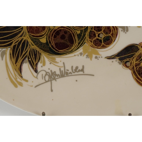 558 - Bjorn Wiimblad for Rosenthal, German porcelain lustre charger decorated with a stylised bird