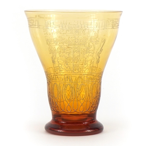 2452 - Olympic interest amber coloured glass beaker commemorating 1928 Amsterdam games by Kristalunie Maast... 