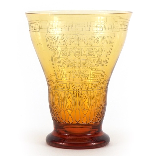 2452 - Olympic interest amber coloured glass beaker commemorating 1928 Amsterdam games by Kristalunie Maast... 