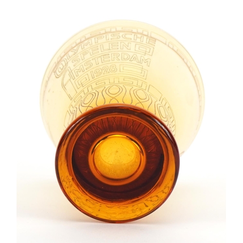 2452 - Olympic interest amber coloured glass beaker commemorating 1928 Amsterdam games by Kristalunie Maast... 