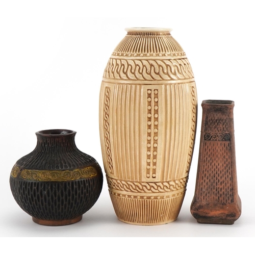 442 - Three Bretby pottery vases including two Clanta examples, 29cm high